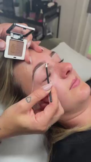 Professional applying Skin Shield Powder: Light Brown